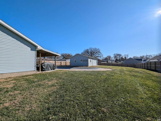 view of yard featuring a patio area and an outbuilding