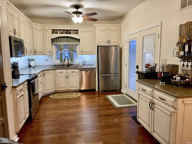 kitchen with ceiling fan, sink, dark hardwood / wood-style floors, and appliances with stainless steel finishes