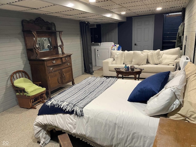 carpeted bedroom with independent washer and dryer