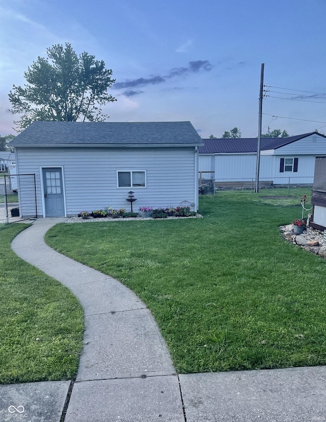 view of side of home featuring a yard