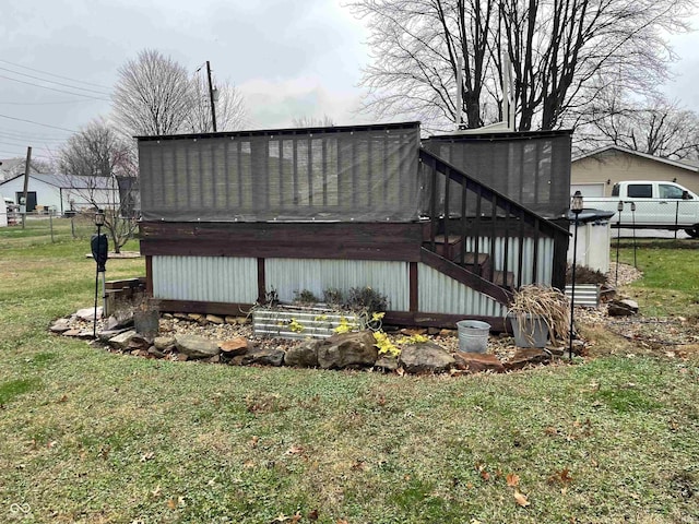 rear view of house featuring a lawn