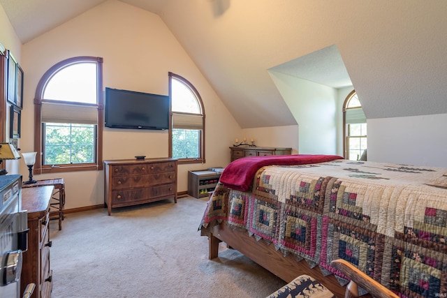 carpeted bedroom featuring vaulted ceiling and multiple windows