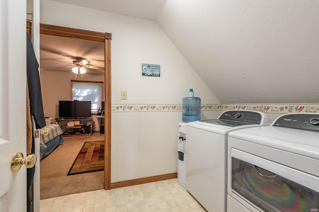 clothes washing area featuring separate washer and dryer, ceiling fan, light colored carpet, and a textured ceiling