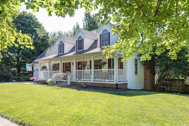 view of front facade with covered porch and a front lawn