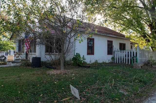 view of property exterior with a yard