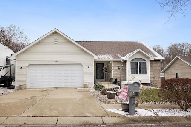 ranch-style house featuring a garage