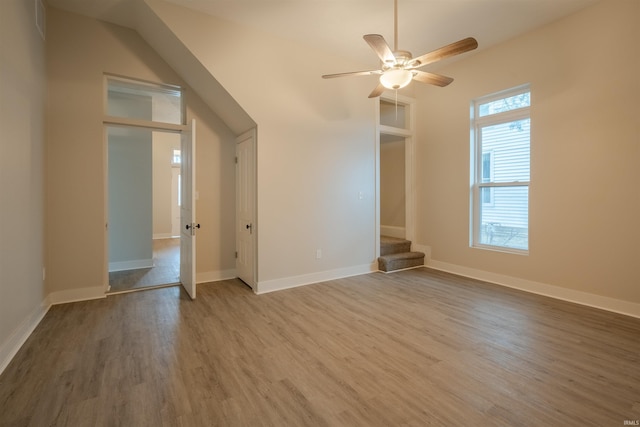 unfurnished living room with hardwood / wood-style flooring and ceiling fan