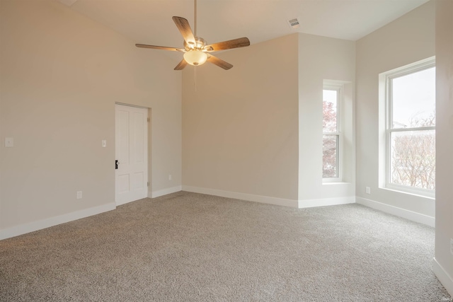 carpeted empty room with ceiling fan