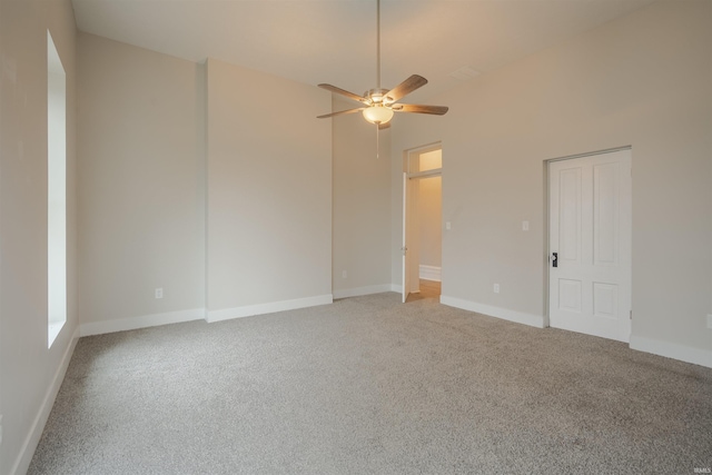 unfurnished room featuring carpet and ceiling fan