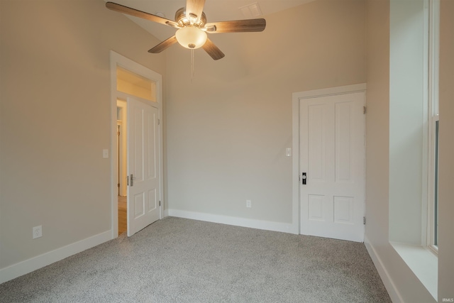 unfurnished room featuring ceiling fan and light colored carpet