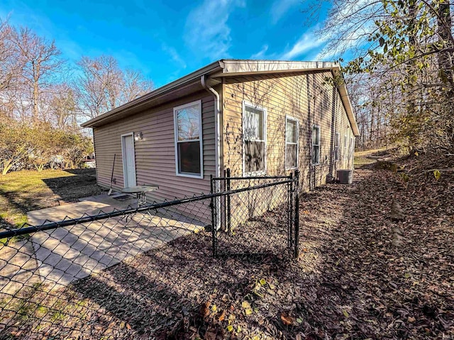 view of home's exterior featuring central AC and a patio area