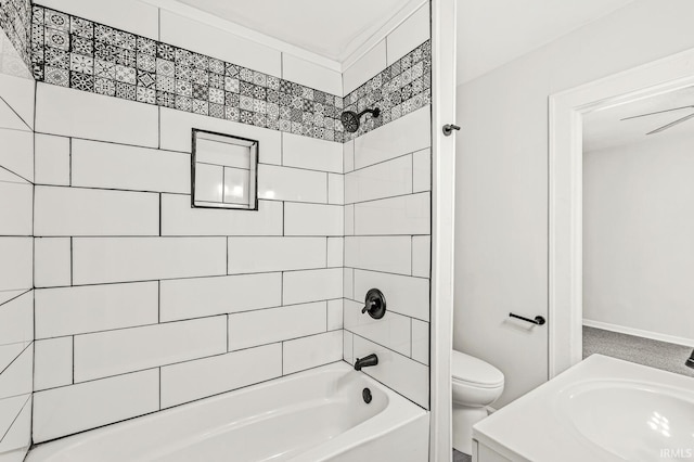 full bathroom with vanity, tiled shower / bath combo, and toilet