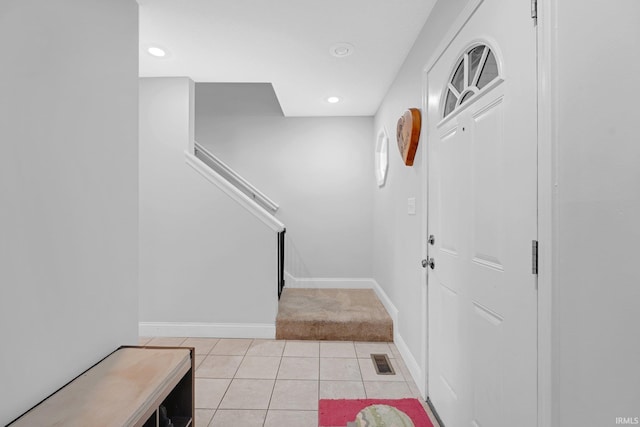 entryway featuring light tile patterned flooring