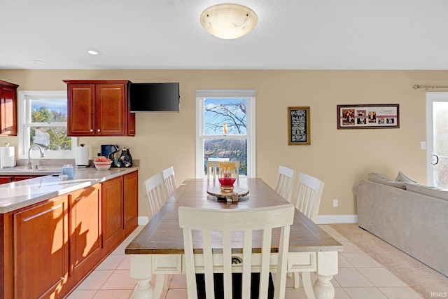 tiled dining space featuring sink