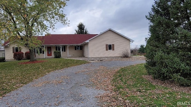 ranch-style home with a front lawn