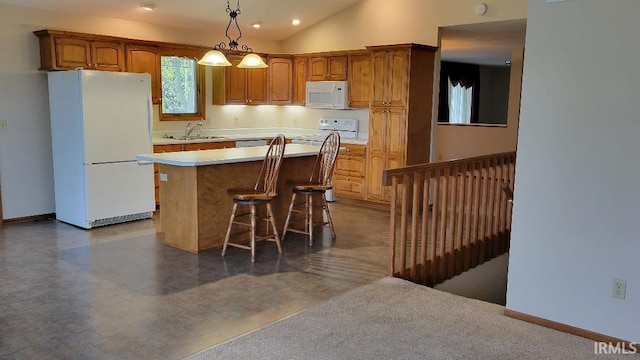 kitchen with a center island, white appliances, sink, vaulted ceiling, and decorative light fixtures