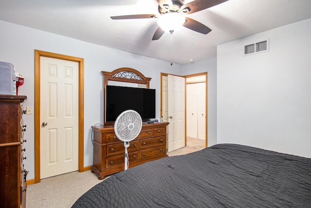 bedroom featuring ceiling fan and light colored carpet