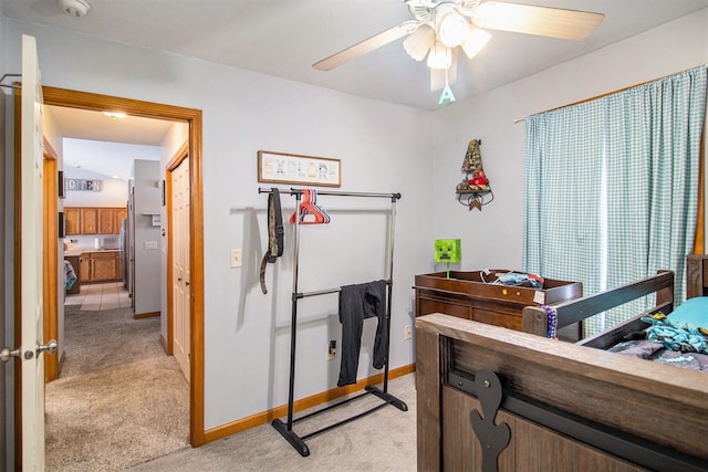 bedroom with ceiling fan and light colored carpet