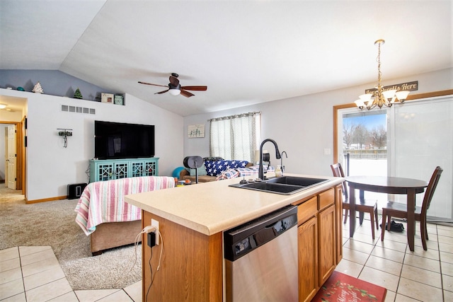 kitchen with a wealth of natural light, sink, stainless steel dishwasher, and a center island with sink