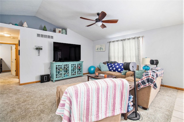 carpeted living room featuring ceiling fan and vaulted ceiling