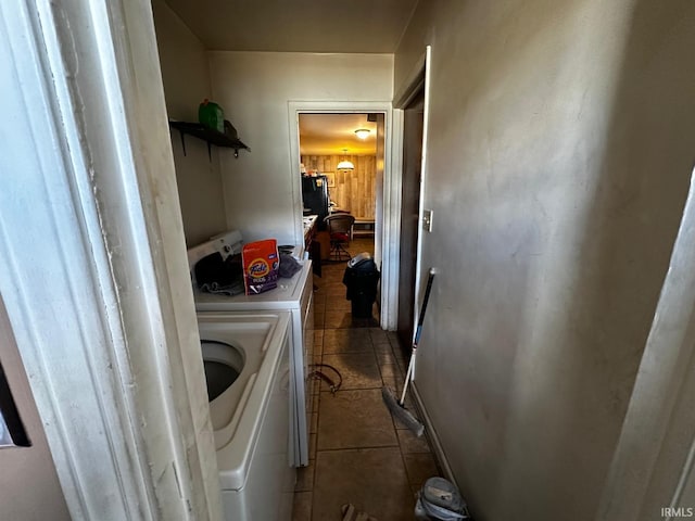 washroom with tile patterned flooring and independent washer and dryer