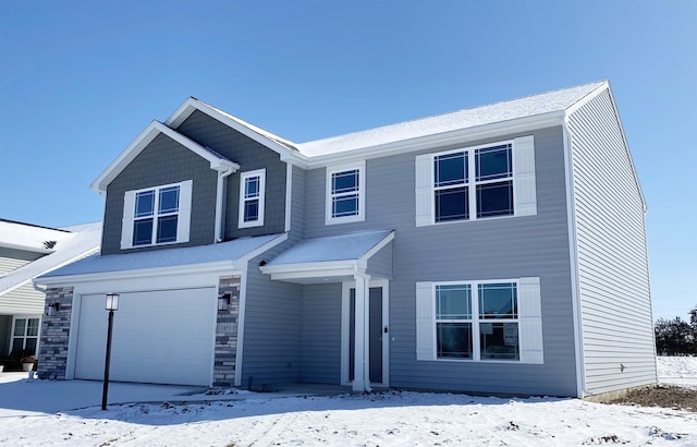 view of front of property with a garage