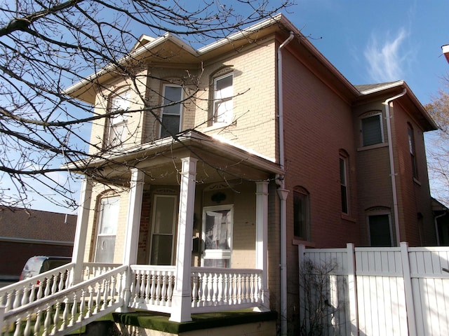 view of property exterior with covered porch