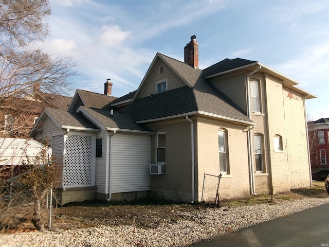 view of side of property featuring cooling unit