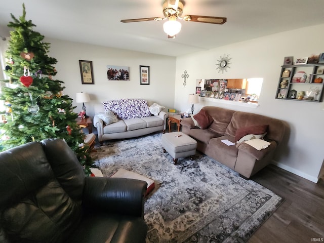 living room with dark hardwood / wood-style floors and ceiling fan