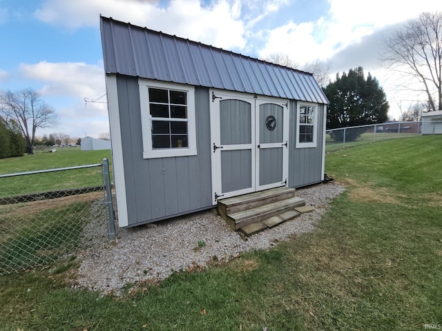 view of outdoor structure with a lawn