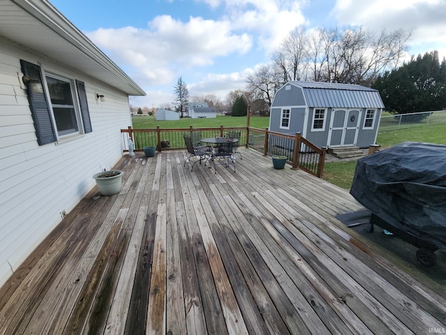 deck with a yard and a storage unit