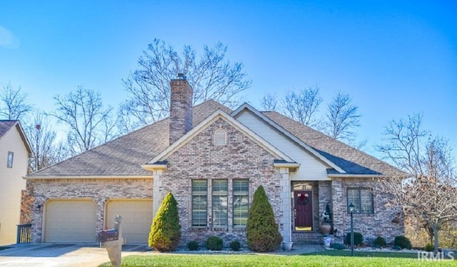 view of front of house featuring a garage and a front lawn