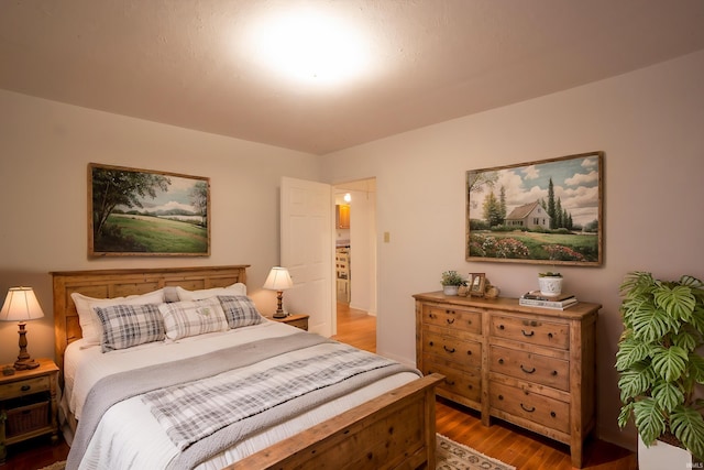 bedroom featuring wood finished floors