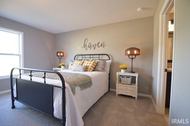 carpeted bedroom with a textured ceiling