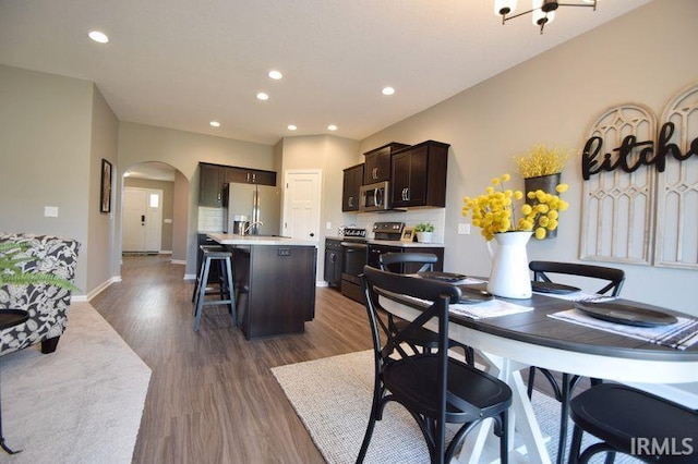 dining area with dark wood-type flooring