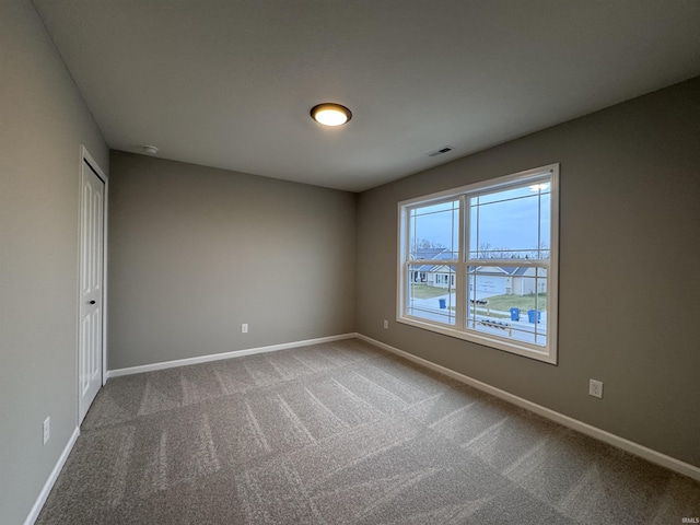 empty room with carpet flooring