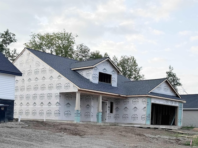 unfinished property with a garage