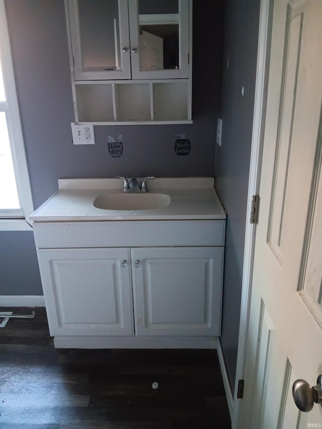 bathroom featuring vanity and hardwood / wood-style flooring