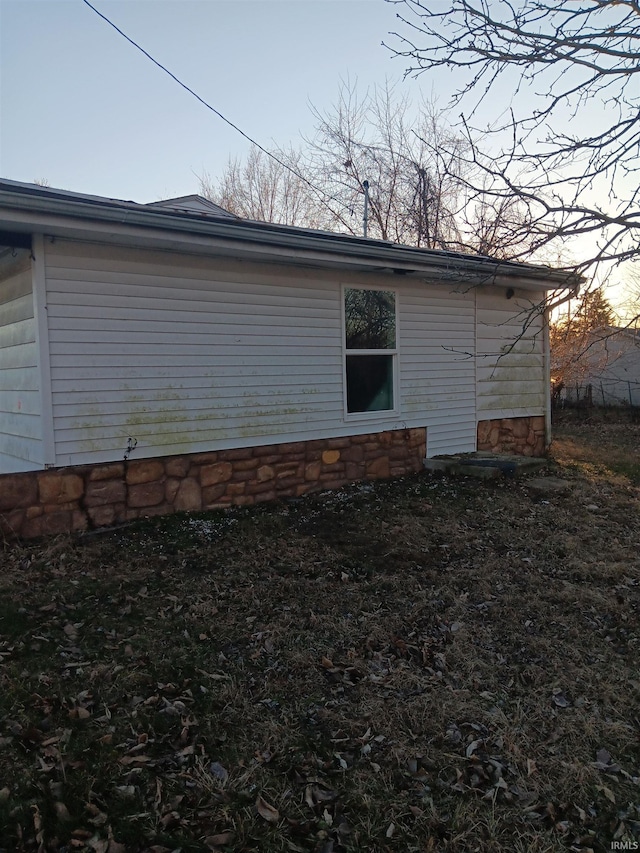 view of property exterior at dusk