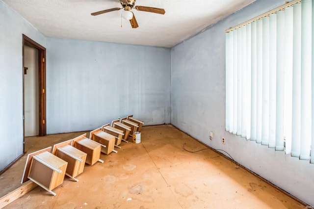 unfurnished room with ceiling fan