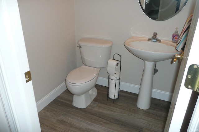 bathroom featuring toilet and hardwood / wood-style flooring