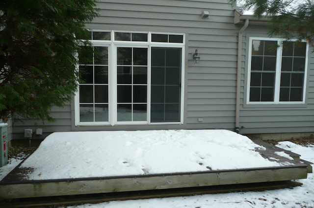 view of snow covered property entrance