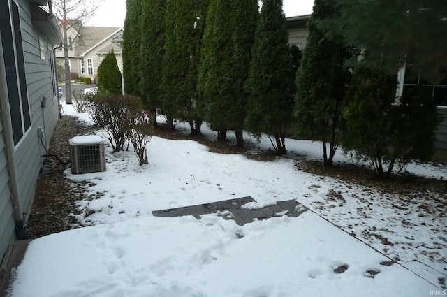 snowy yard with central air condition unit