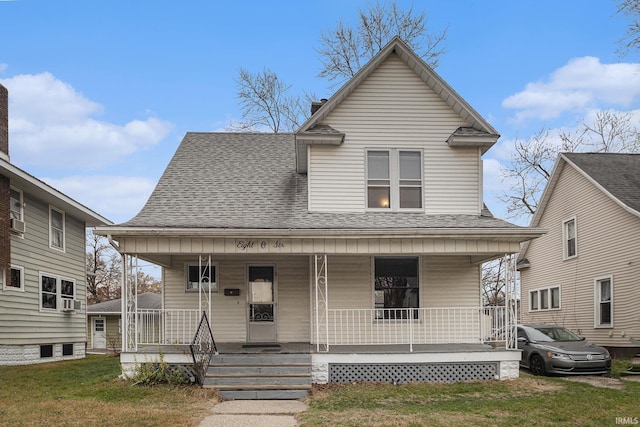 view of front of house featuring a front lawn and covered porch