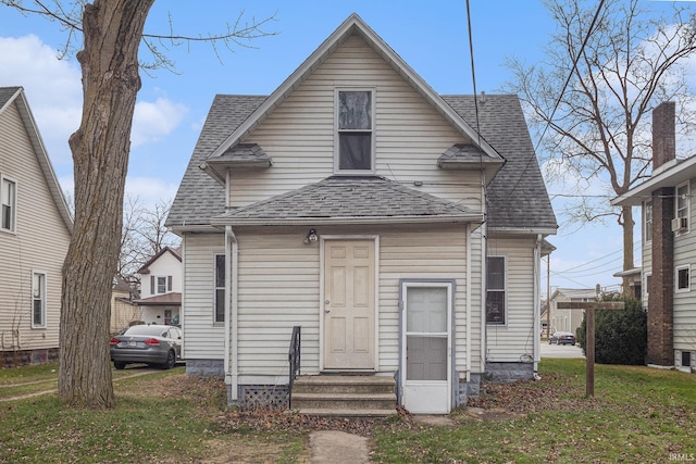 back of house featuring a yard