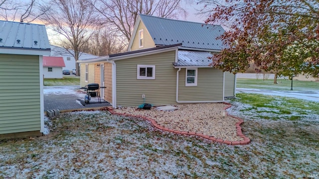 view of property exterior at dusk