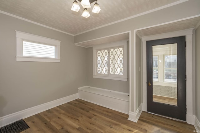 interior space with a healthy amount of sunlight and hardwood / wood-style flooring