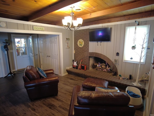 living room with beam ceiling, dark hardwood / wood-style flooring, wooden ceiling, and a brick fireplace