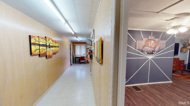 hall with wood-type flooring