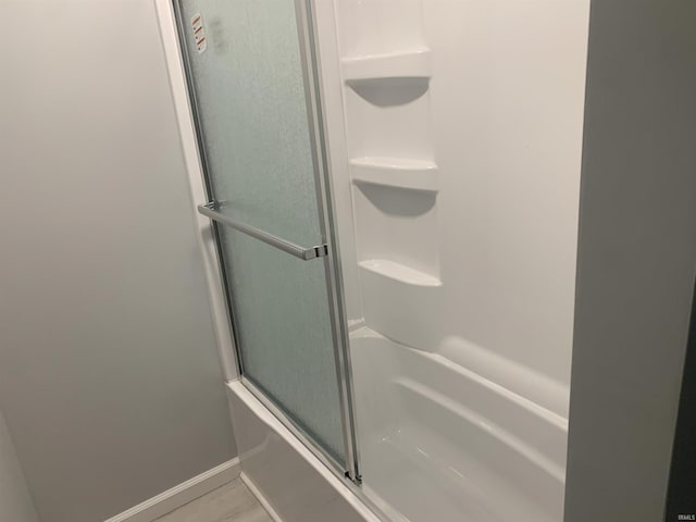 bathroom with hardwood / wood-style flooring